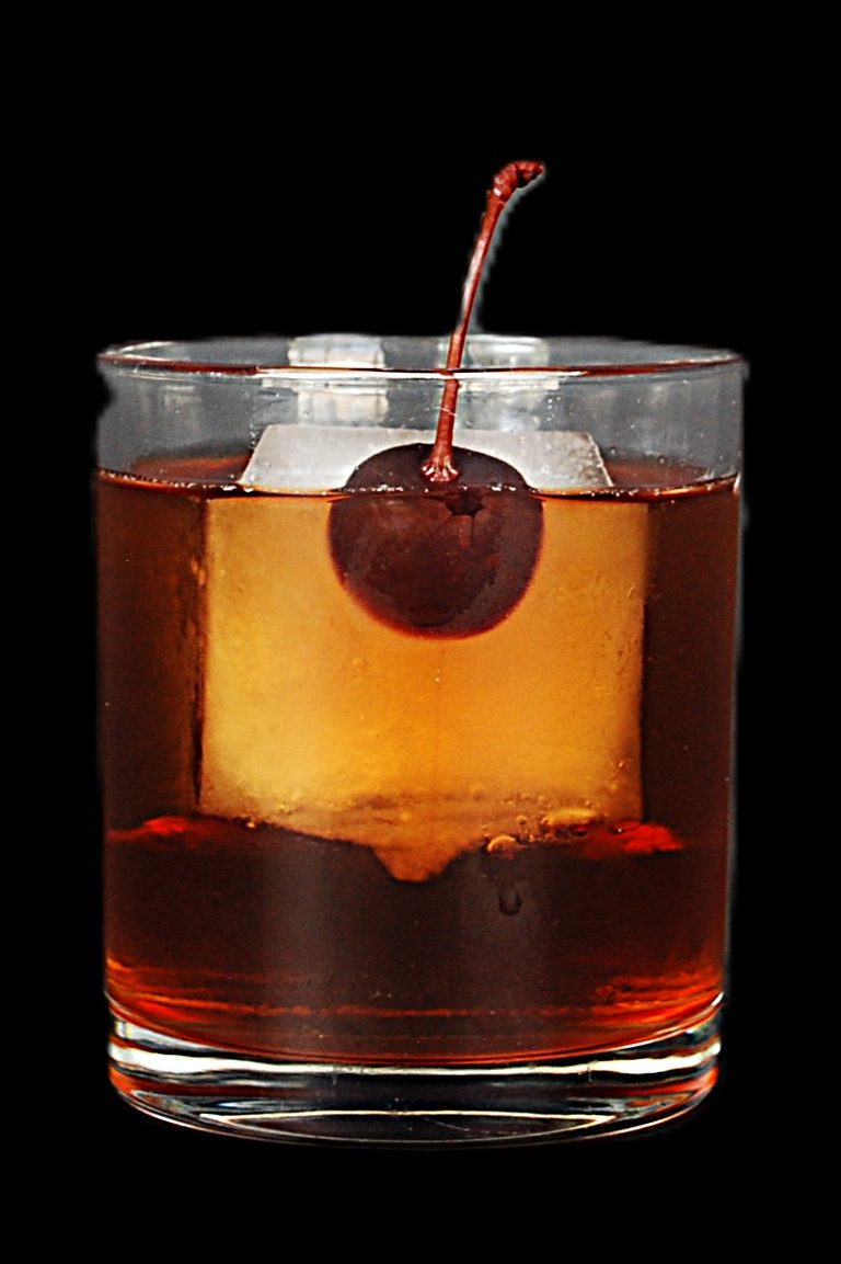 The Pianoman-hatten — Nash Keys signature Manhattan with a cherry over a big cube