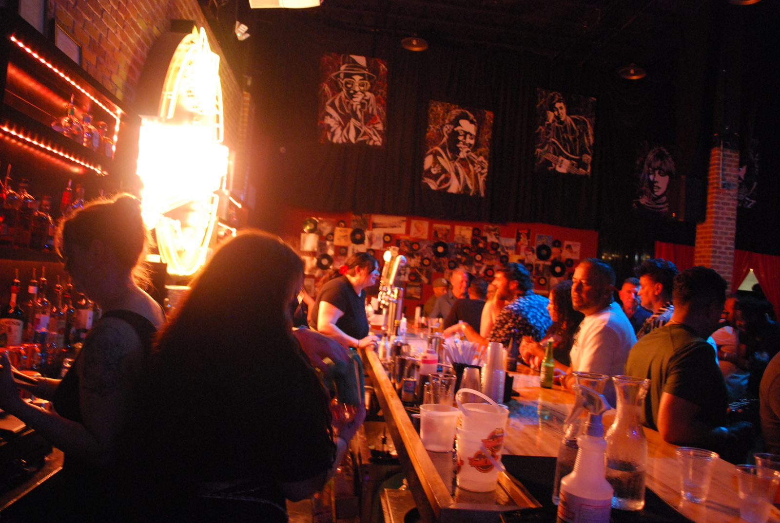 A full house at The Nash Keys — crowd along the bar under vinyl records and music art
